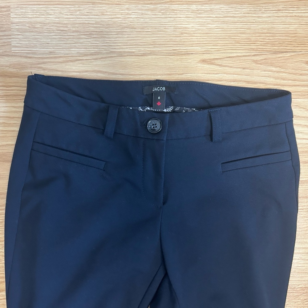 Navy blue Jacob trousers in excellent condition.